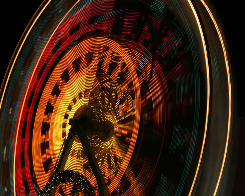 Spinning lights of a Ferris wheel