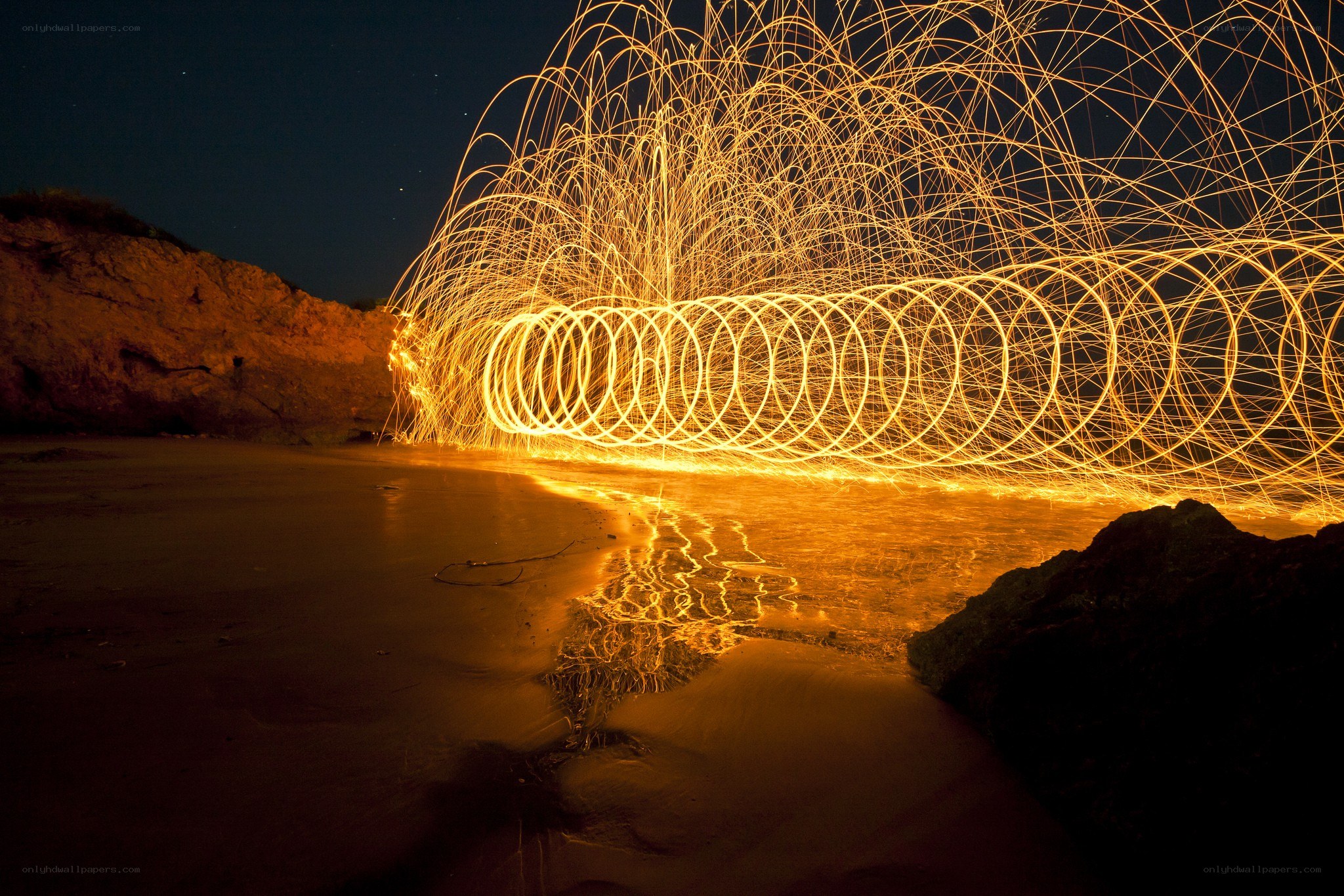 Spinning steel wool on a beach