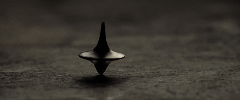 spinning top on dark surface