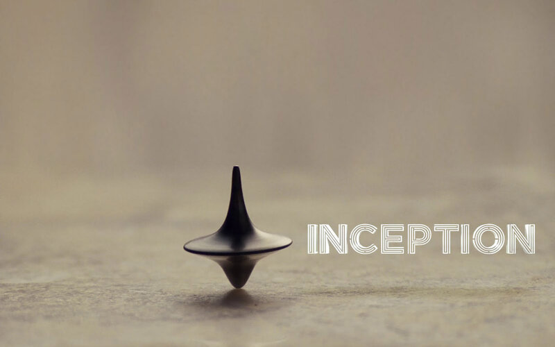 Spinning Top on Surface — Black, Dramatic