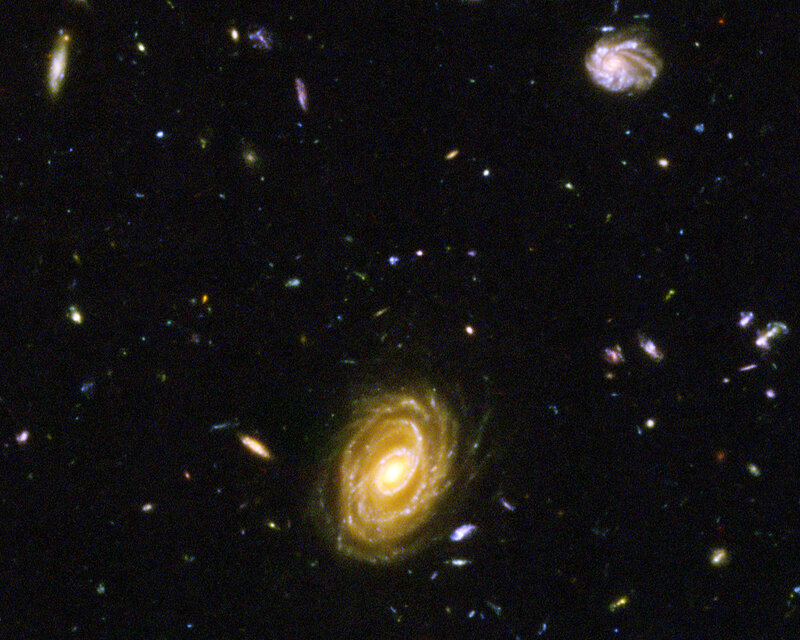 Spiral Galaxy in Space — Black, Cosmic, Photograph, Stars, Yellow