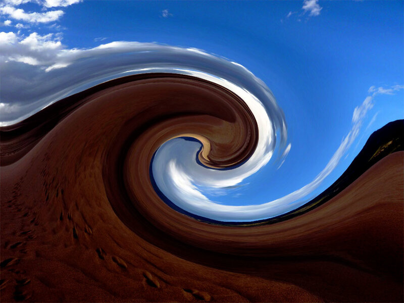 Spiral sand dune under blue sky