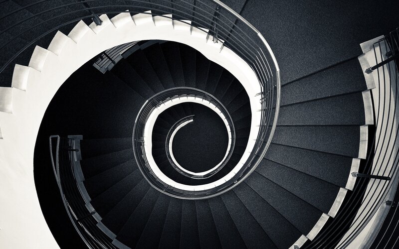 Spiral Staircase from Above — Black, Dramatic, Photograph