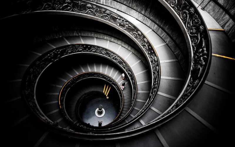 Spiral Staircase from Above — Black, Dramatic