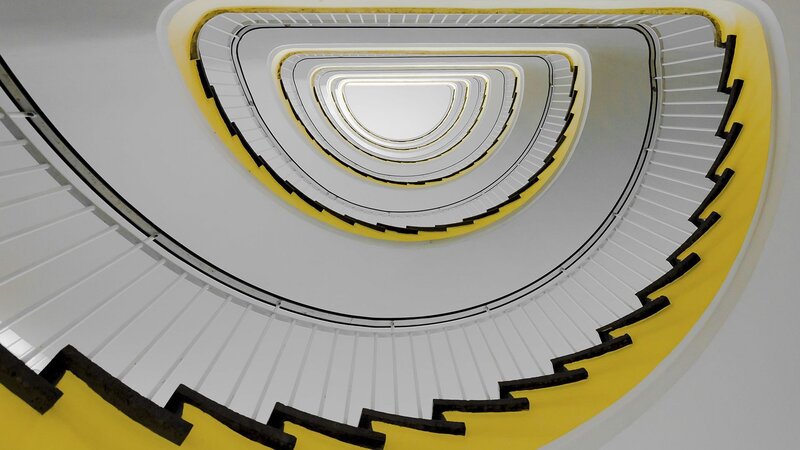 Spiral Staircase from Below — White, Geometric