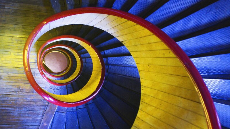Spiral staircase with colorful rail