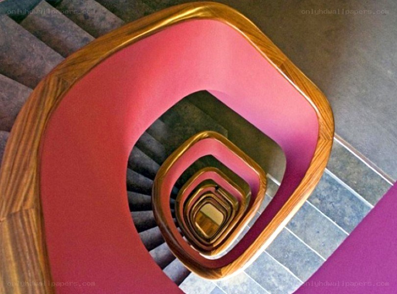 Spiral staircase with pink railing