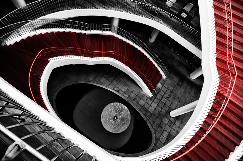 spiral staircase with red accents