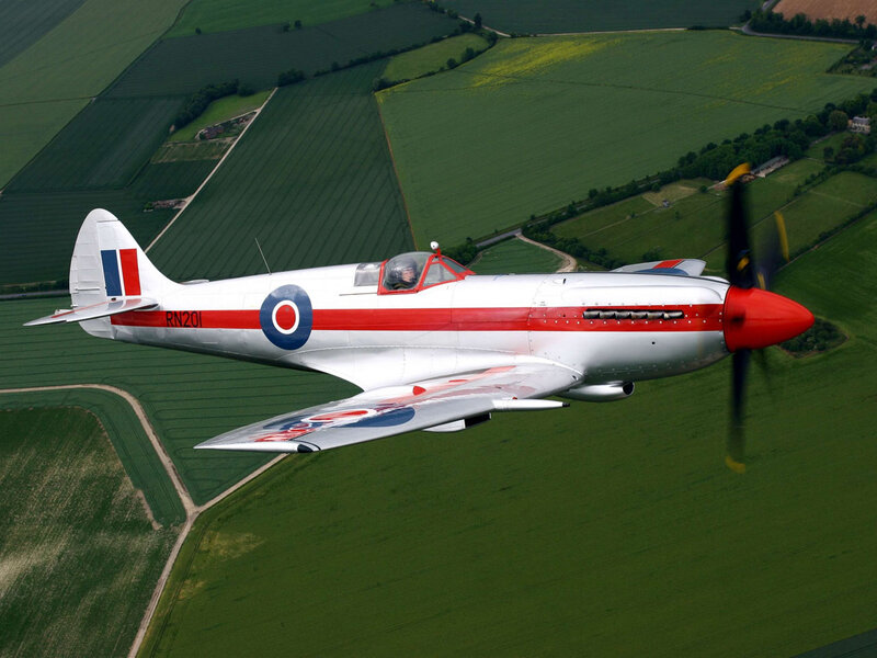 Spitfire Aircraft in Flight — Green, Calm, Afternoon