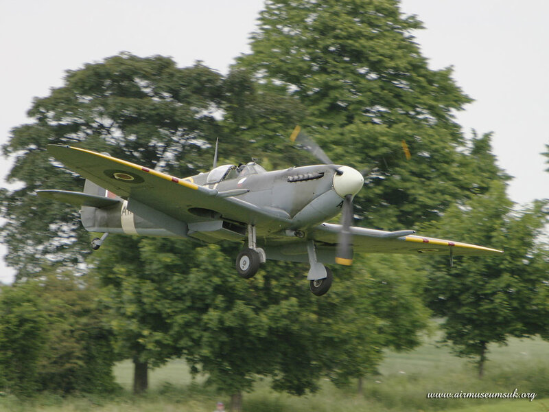 Spitfire Aircraft in Flight — Green, Dynamic, Afternoon, Photograph, Trees