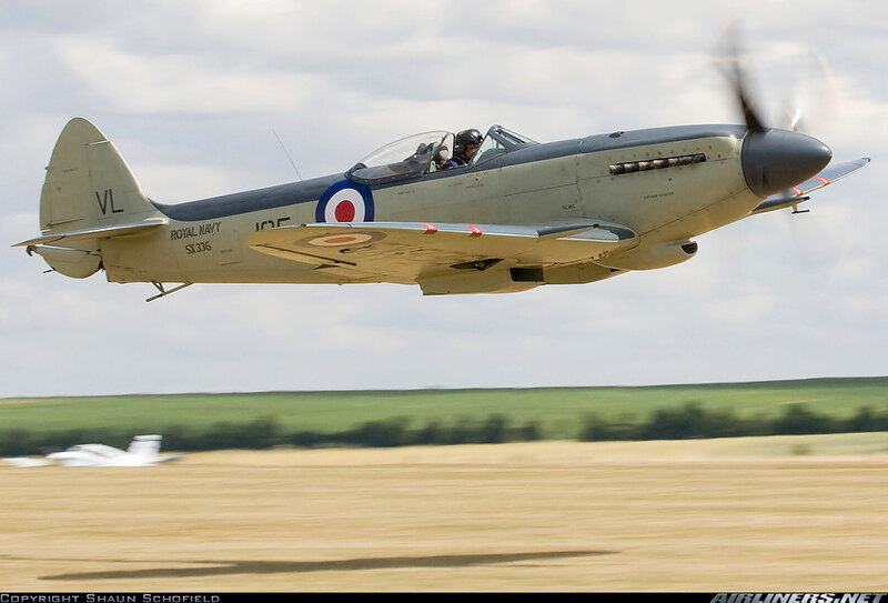 Spitfire Aircraft in Flight — Green, Dynamic, Afternoon