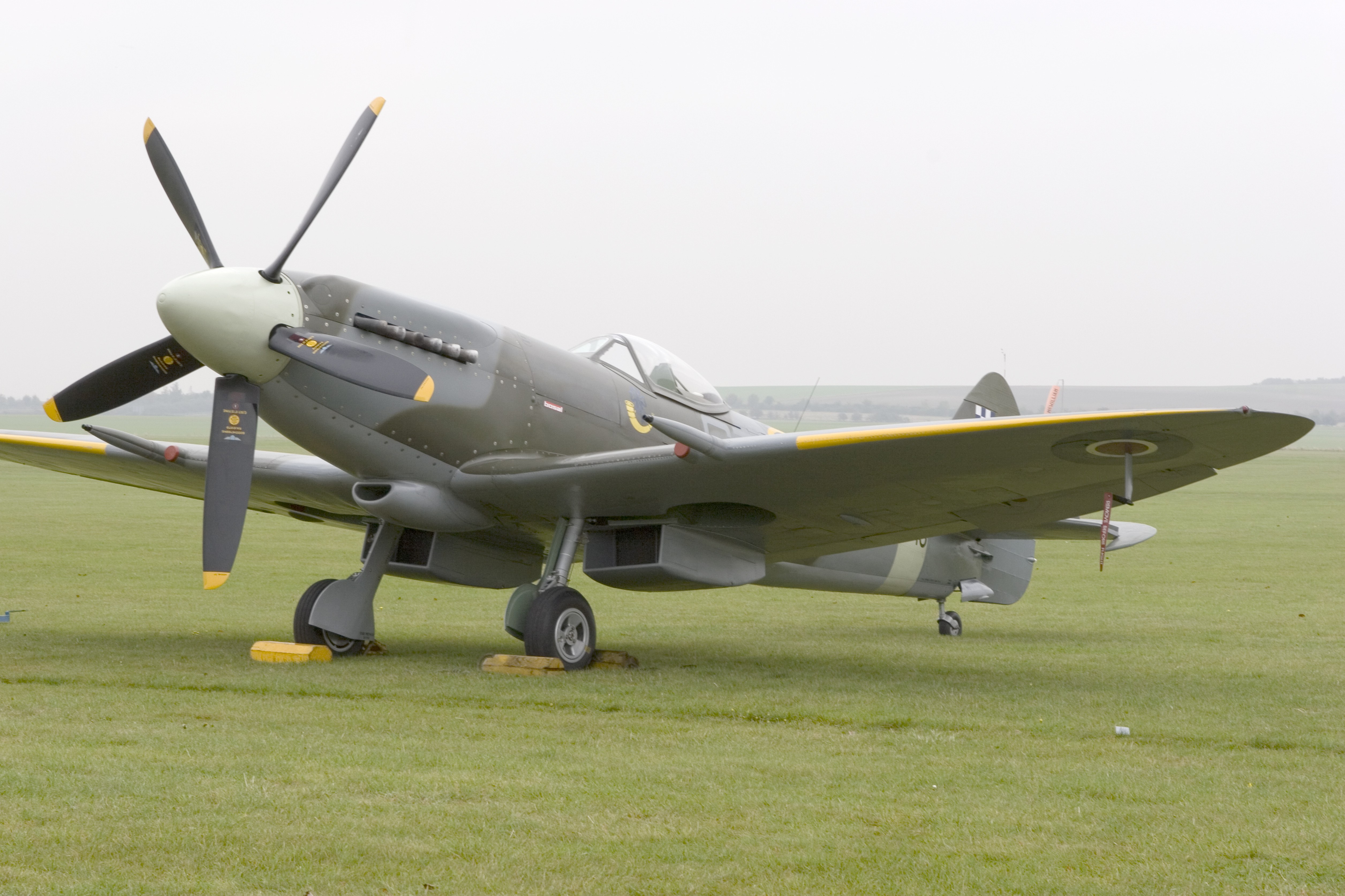 Spitfire aircraft on grass field