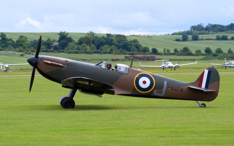 Spitfire Aircraft on Grass — Green
