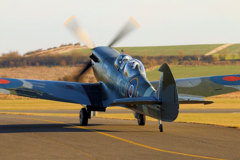 Spitfire Aircraft on Runway — Blue