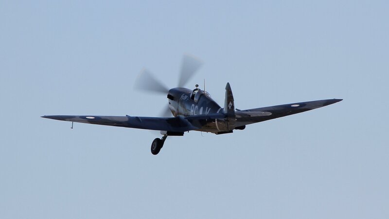Spitfire Airplane in Flight — Blue, Calm