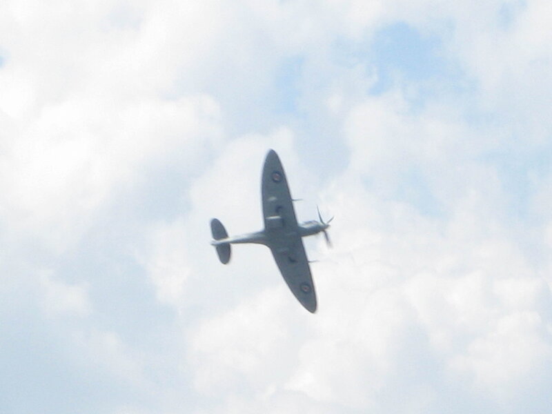 Spitfire Airplane in Flight — Gray, Calm