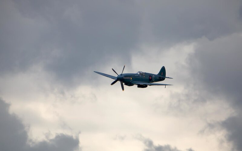 Spitfire Airplane in Flight — Gray, Dramatic