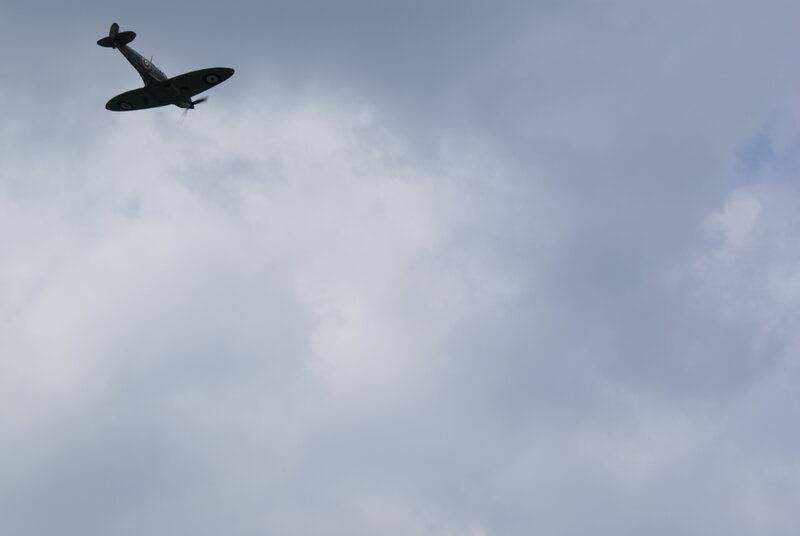 Spitfire Airplane in Flight — Gray, Overcast