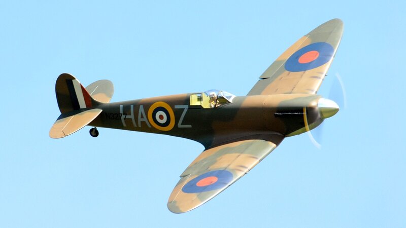 Spitfire Fighter Plane — Blue, Dynamic, Afternoon, Photograph, Aircraft