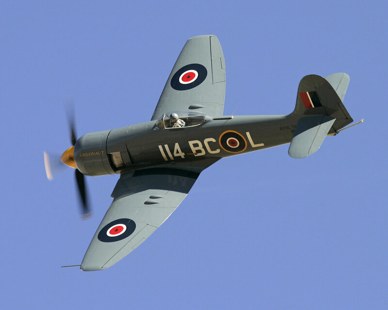 Spitfire Fighter Plane — Blue, Dynamic, Afternoon, Photograph, Propeller
