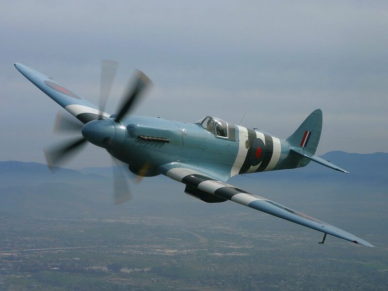 Spitfire Fighter Plane — Blue, Dynamic, Daytime