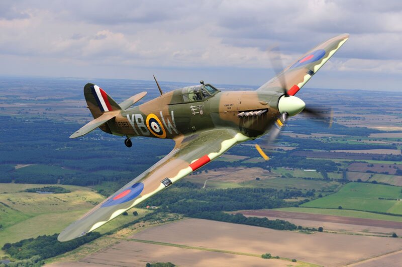 Spitfire Fighter Plane — Green, Dynamic, Afternoon, Photograph, Aircraft