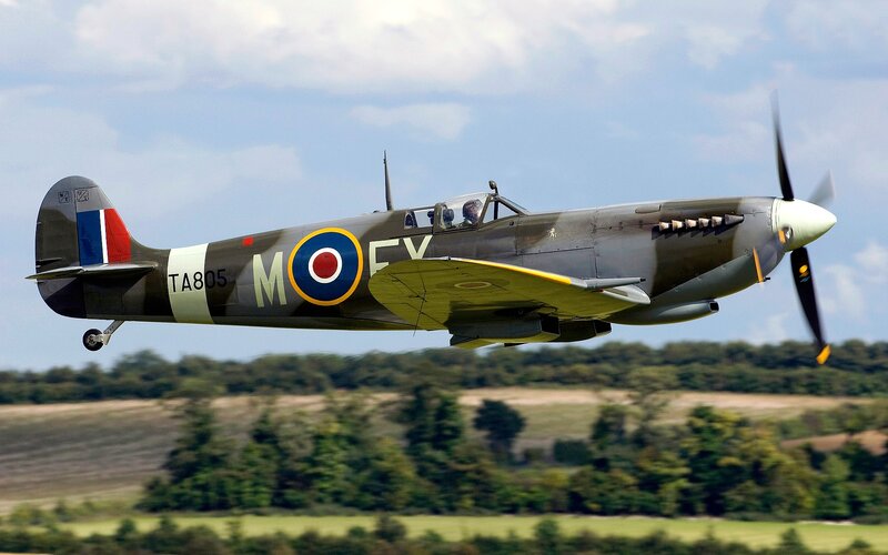 Spitfire Fighter Plane — Green, Dynamic, Afternoon, Photograph, Propeller, Pilot