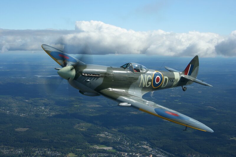 Spitfire Fighter Plane — Green, Serene, Afternoon, Photograph, Clouds