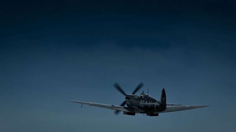 Spitfire in flight at dusk