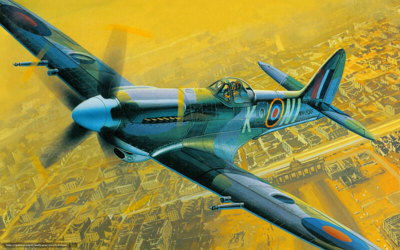 Spitfire in flight over city