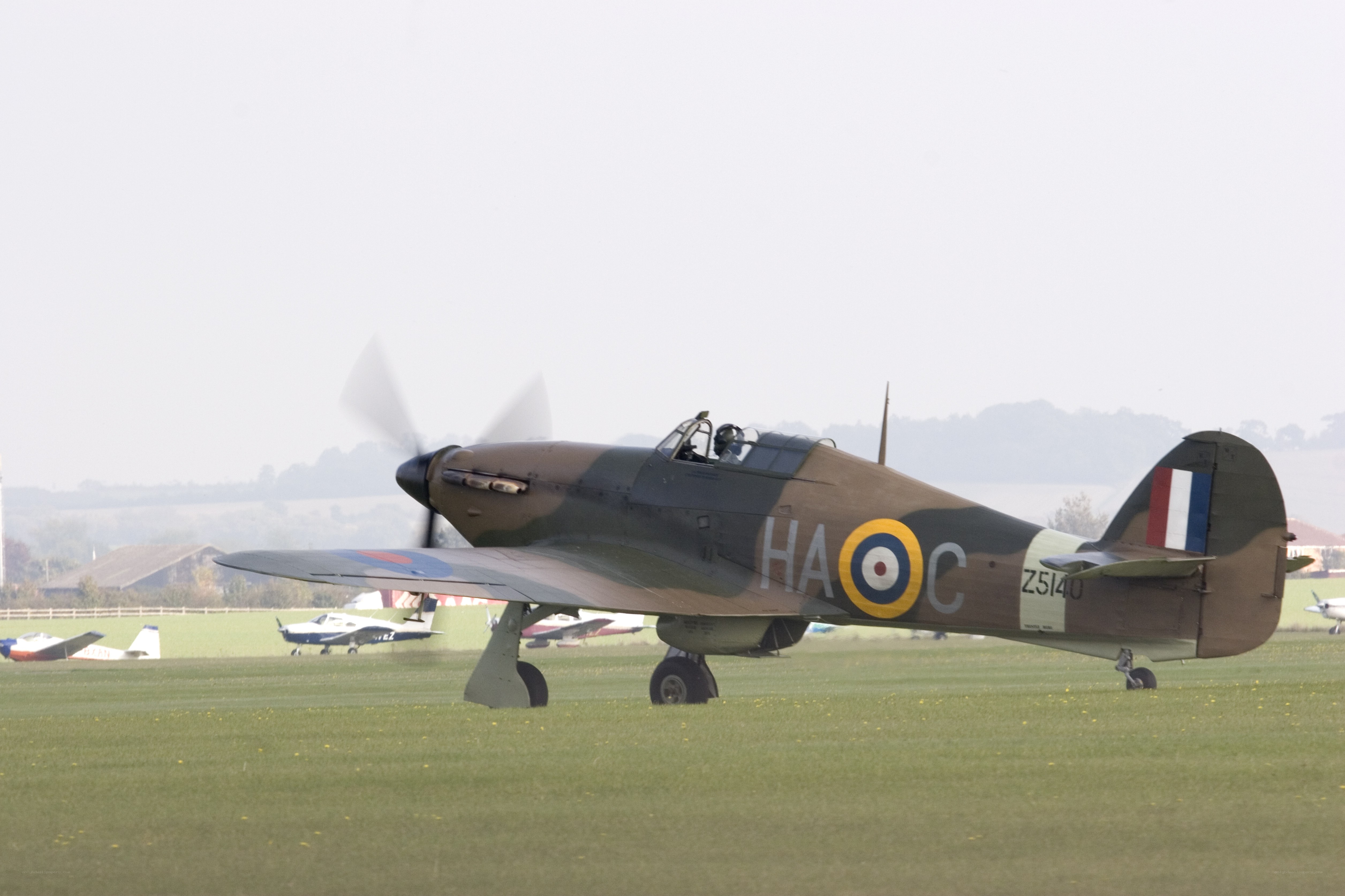 Spitfire on a grass airfield