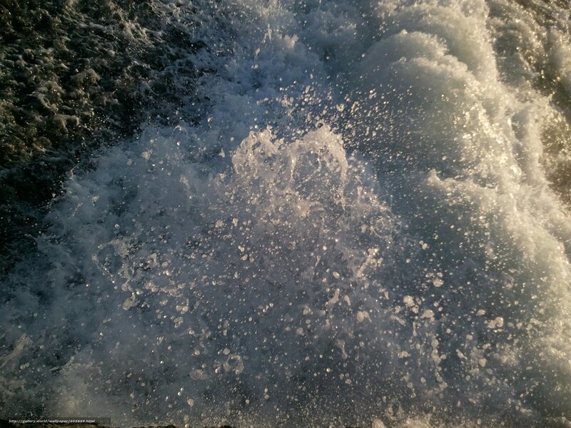 splashing water at sunset