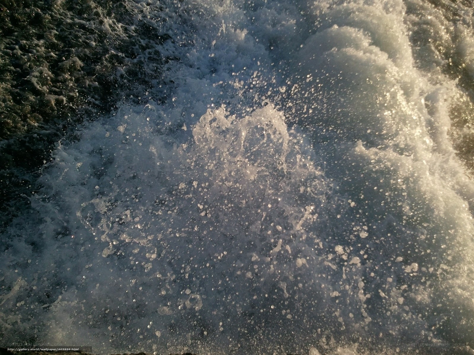 splashing water at sunset