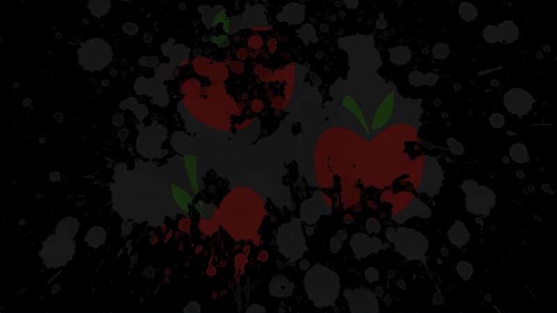 splattered red apples on black