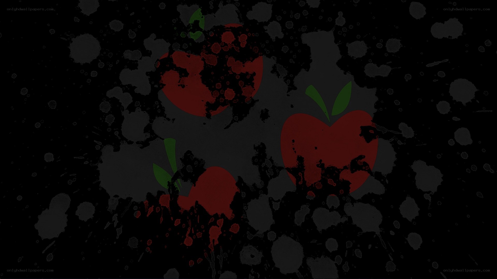 splattered red apples on black