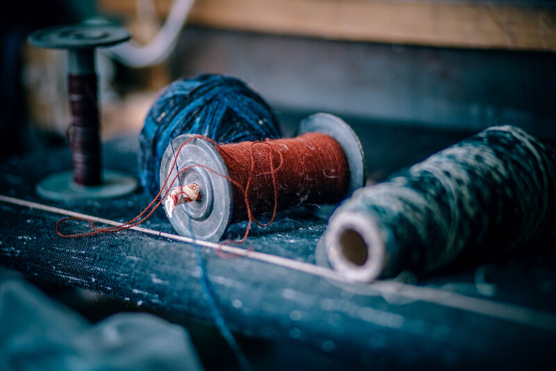Spools of thread on a workbench