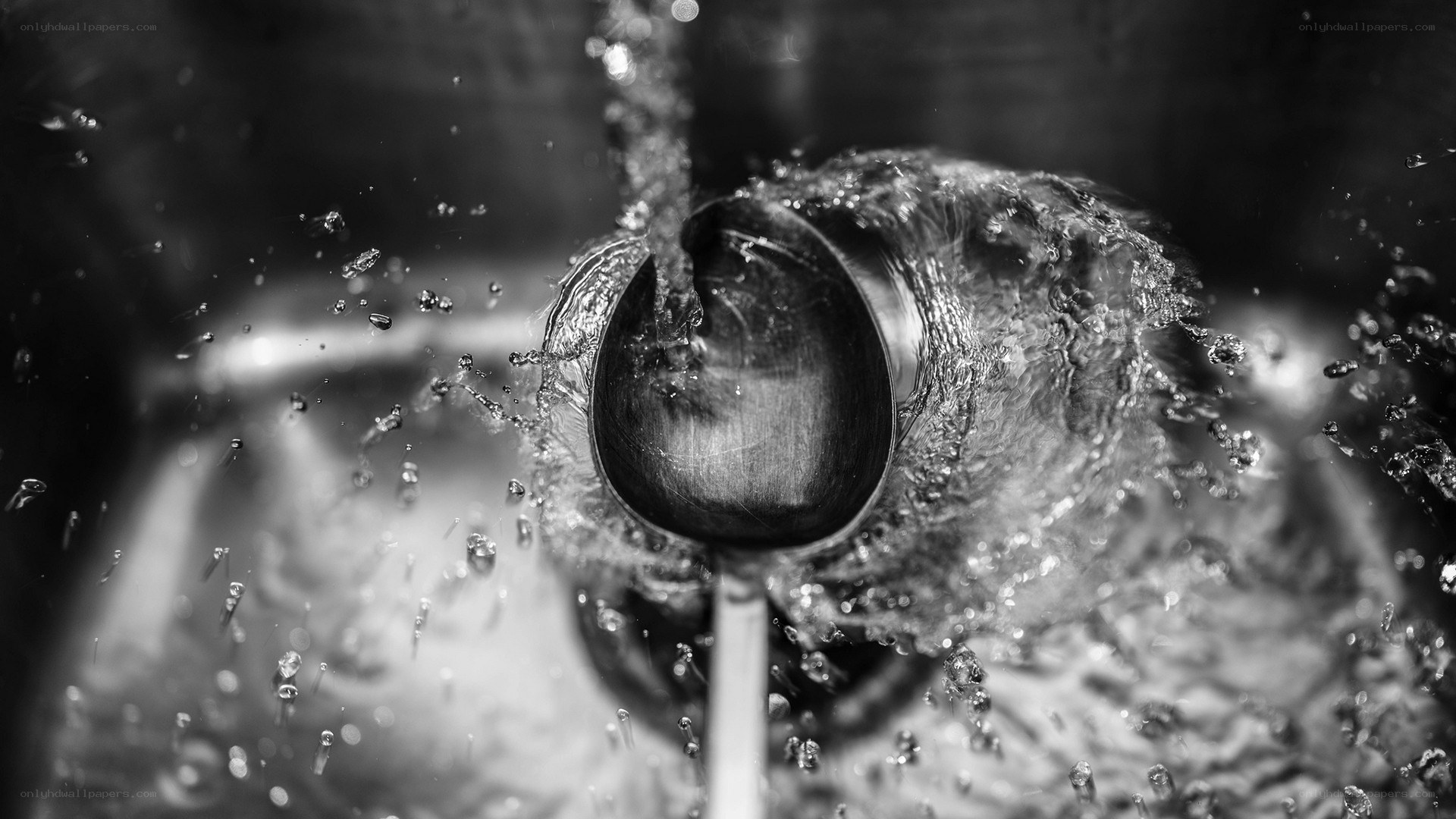 spoon under running water