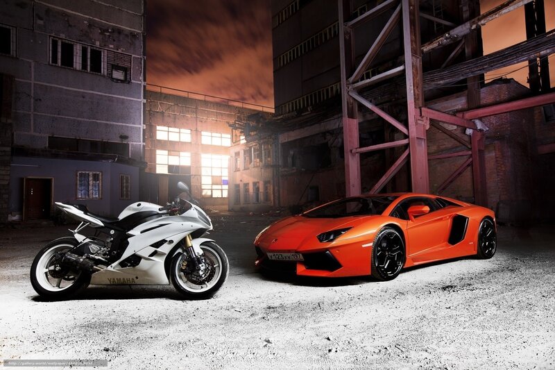 Sports car and motorcycle in warehouse