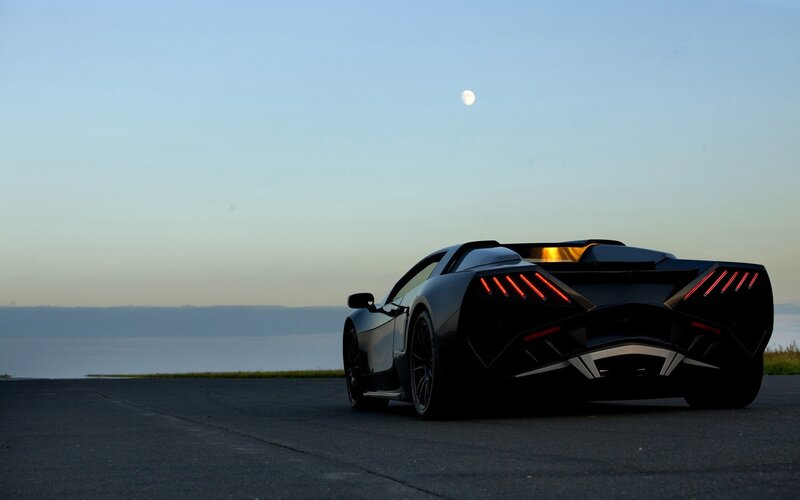 sports car at dusk with moon