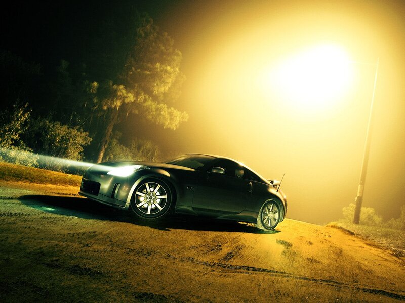 sports car at night on dirt road