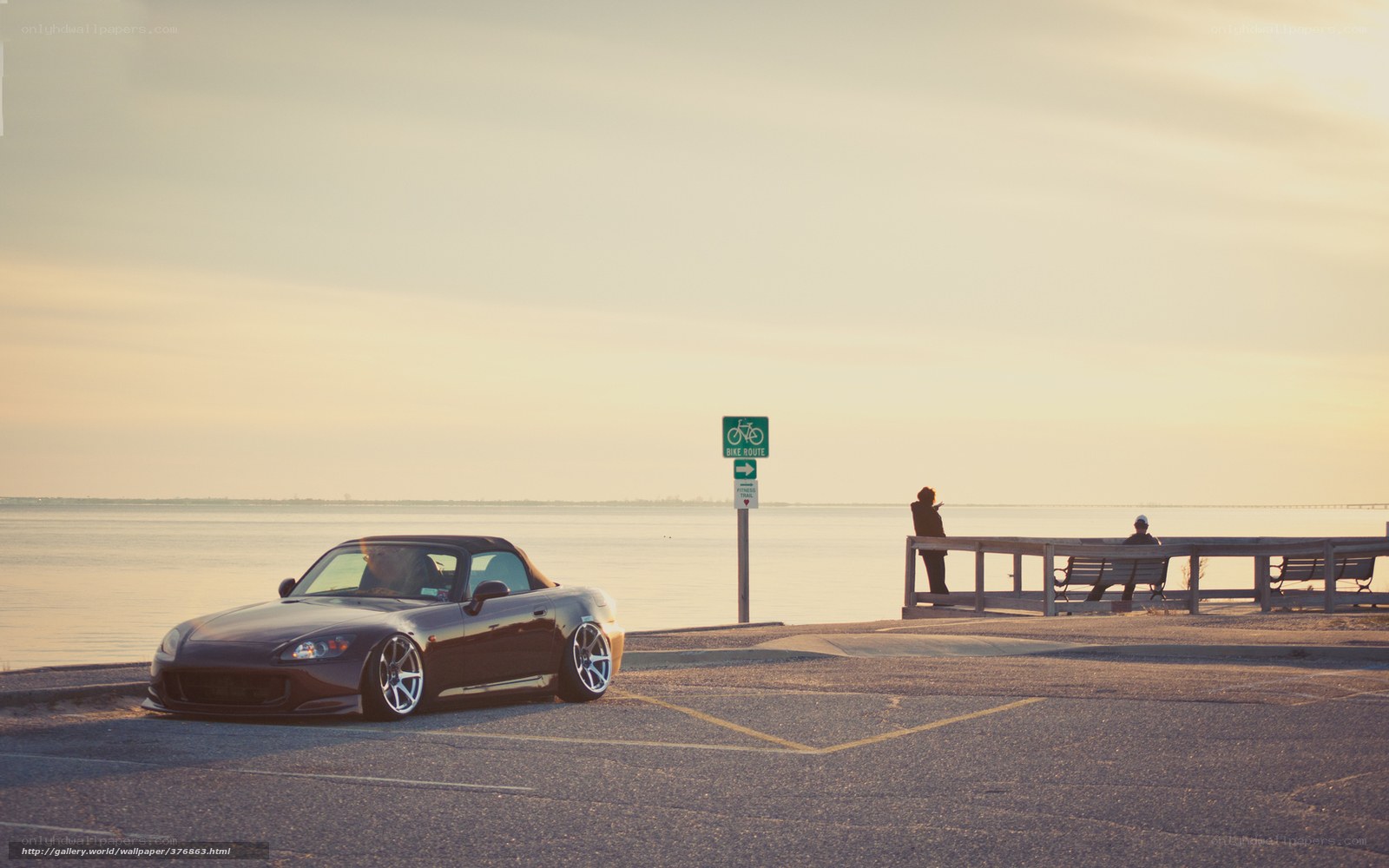 Sports car at sunset by the water