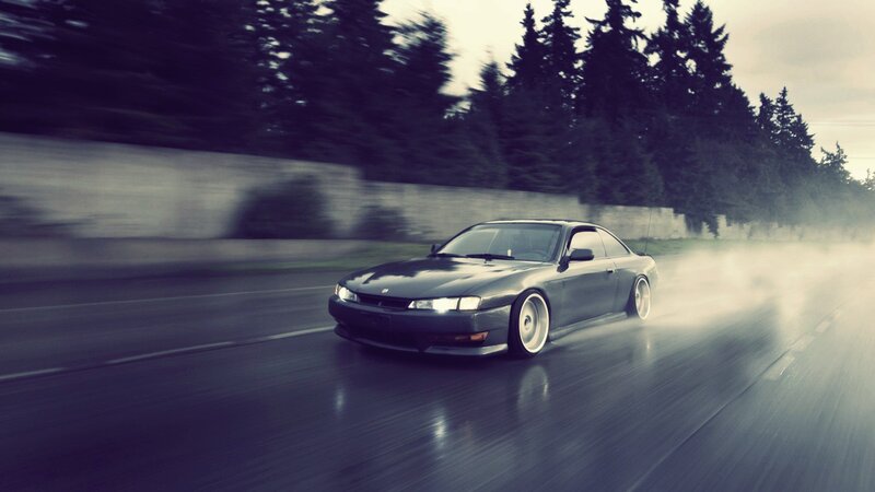 sports car drifting on wet road