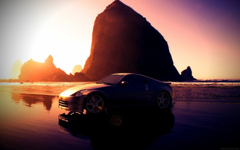 sports car on beach at sunset