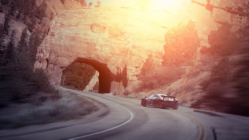 Sports Car on Mountain Road — Orange