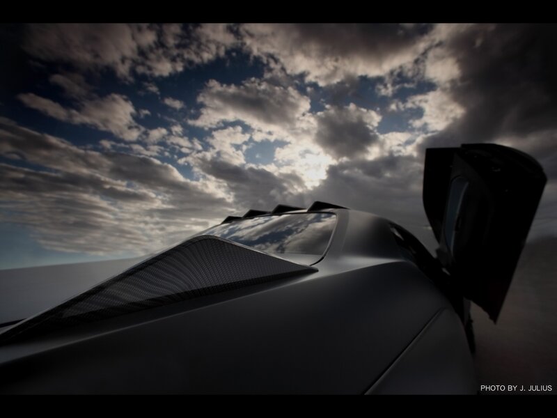 sports car under cloudy sky