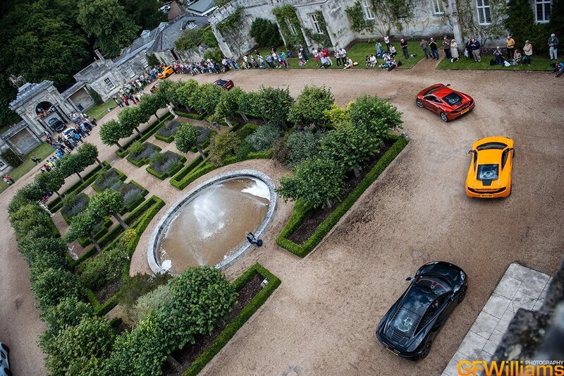 Sports cars at a garden event