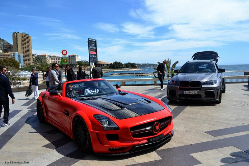 Sports cars at a seaside event