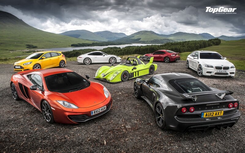 sports cars in a scenic landscape