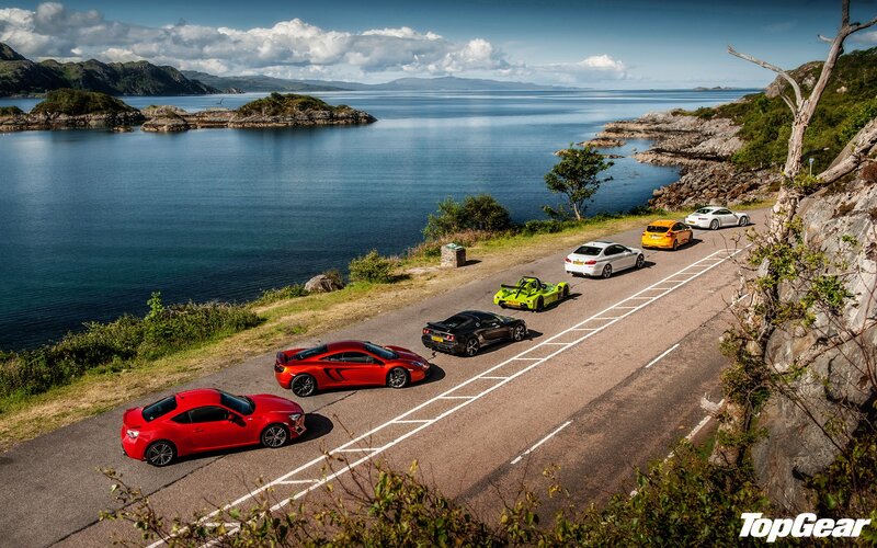 sports cars on coastal road
