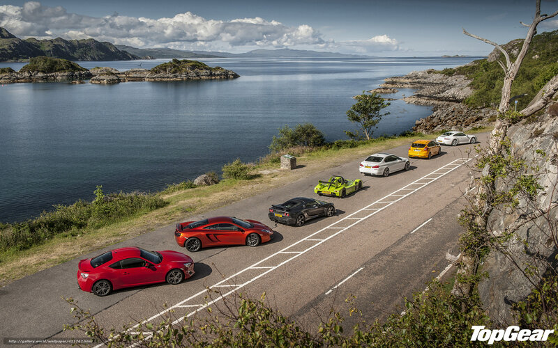 Sports cars on coastal road